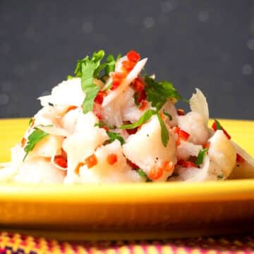 Ceviche on yellow plate.