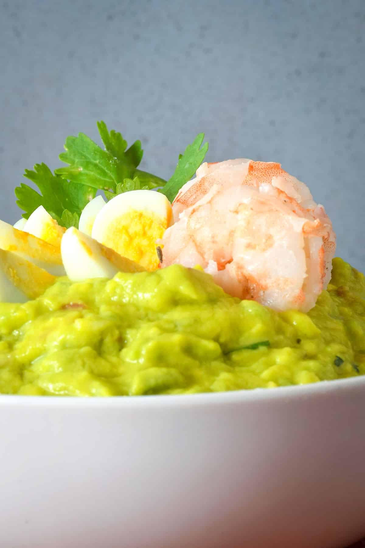 Shrimp and quail eggs in guacamole.
