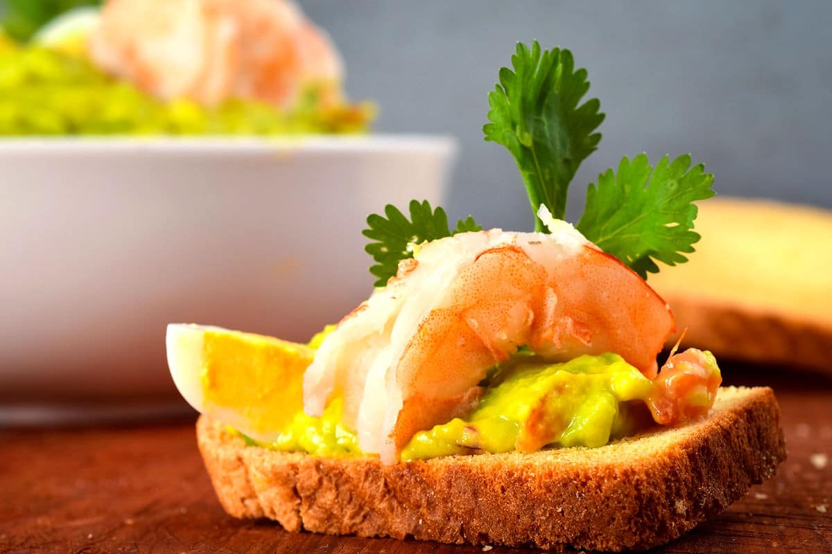 Shrimp and quail egg guacamole on toast.
