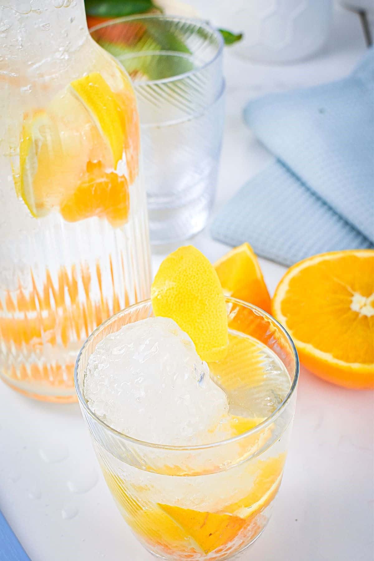 Citrus infused water in glass with ice.