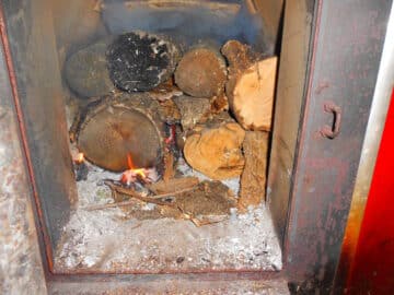 Log fire in old furnace.