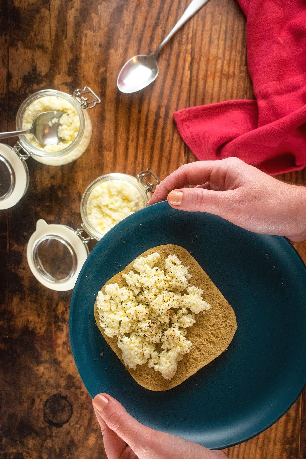 Ricotta cheese on toast on blue plate.