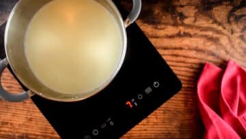 Pot of milk on heating element.
