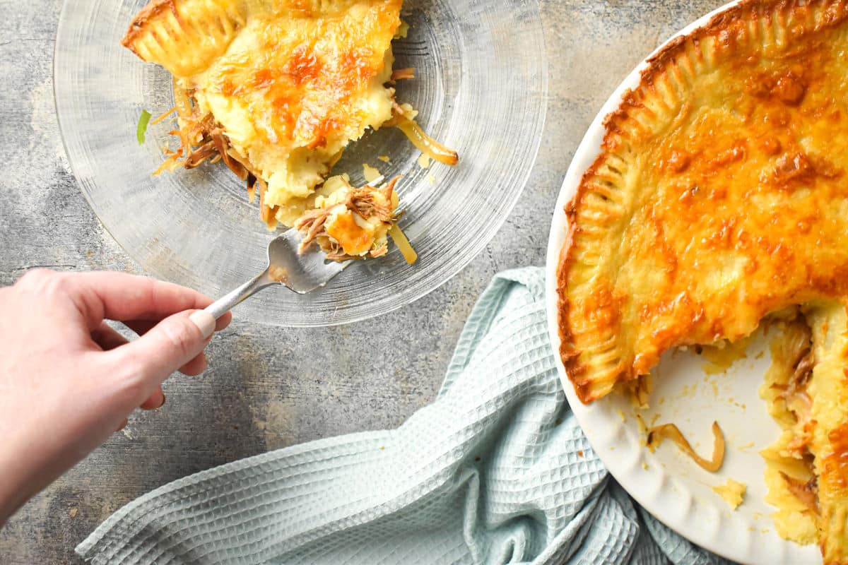 Shepherd's pie on plate and in pie dish.
