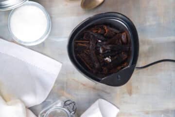 Vanilla bean pieces in coffee grinder.