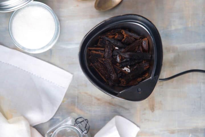 How to Make Vanilla Powder Step 6 Vanilla bean pieces in coffee grinder.