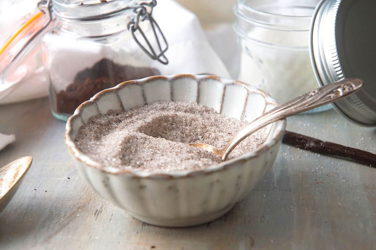 Vanilla sugar in bowl with spoon.