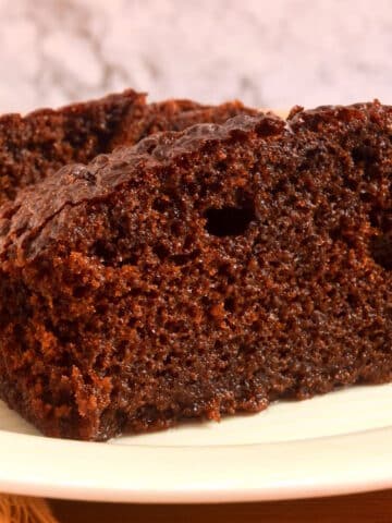 Moist chocolate cake on plate.
