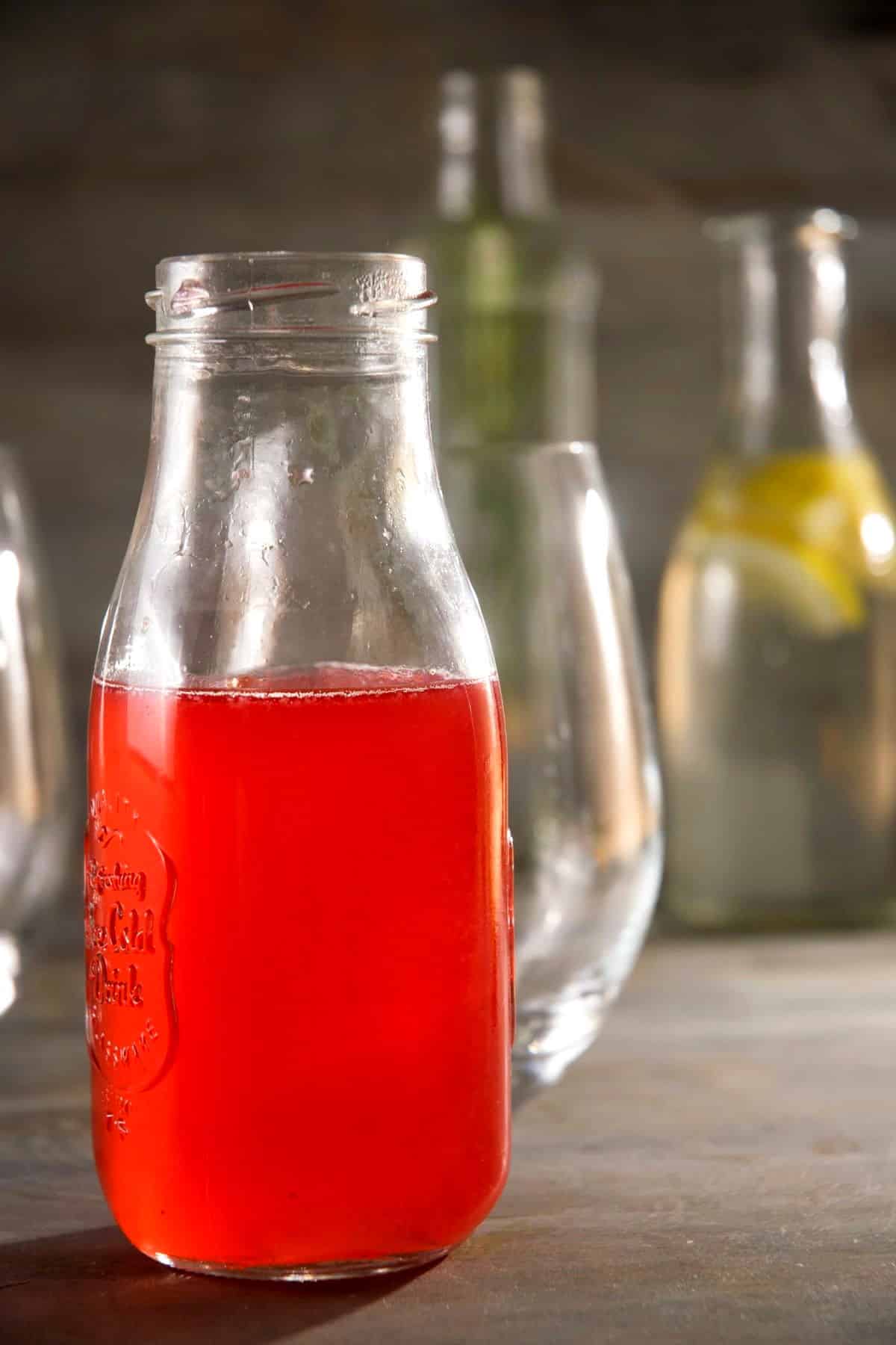 Raspberry cocktail syrup in jar.