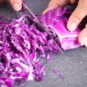 Red cabbage shredded with knife.