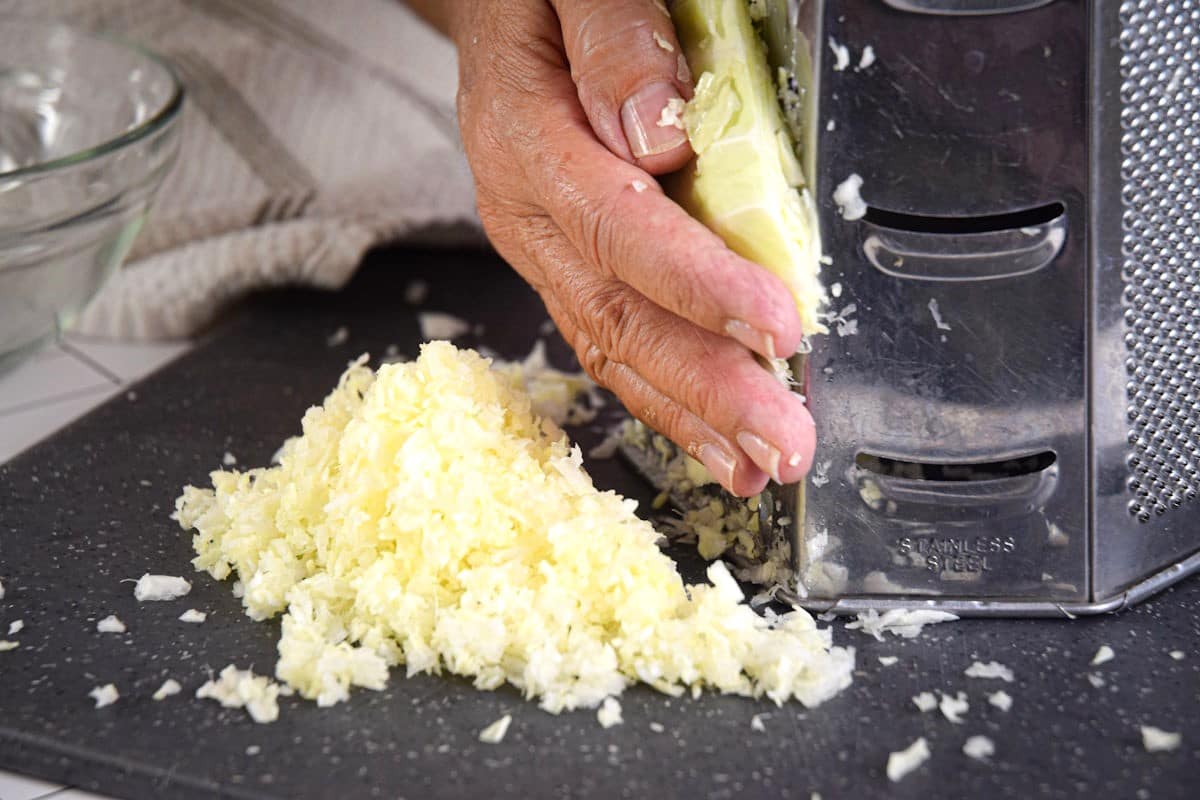 Green cabbage shredded with box grater.