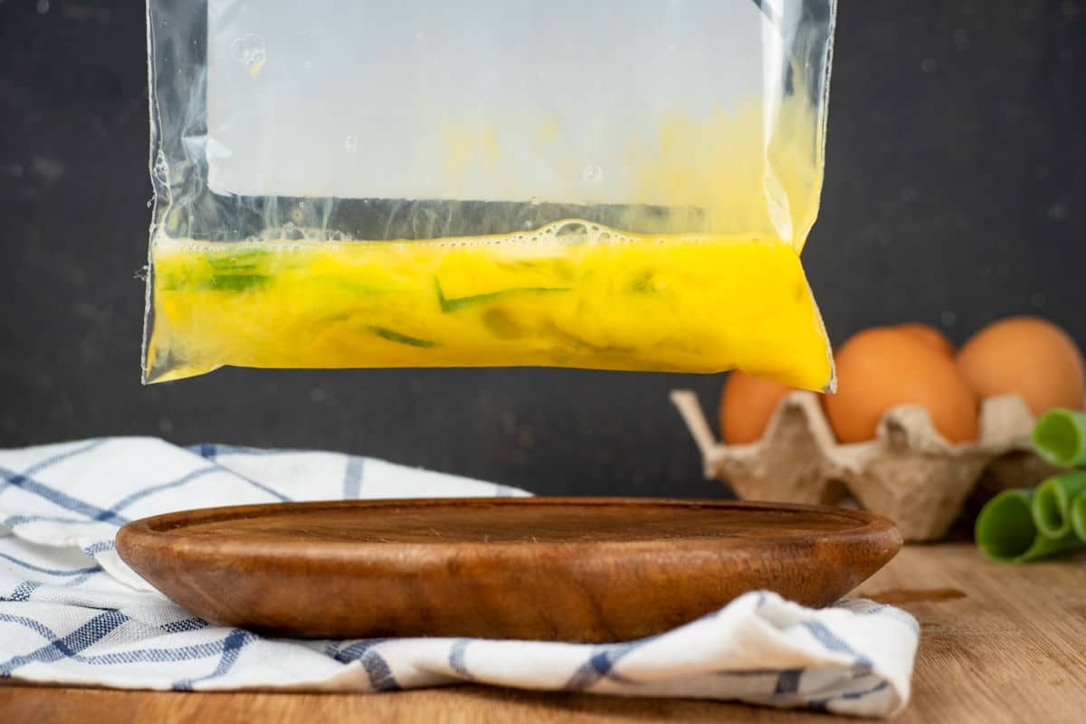 Raw egg scrambled in zip top bag.