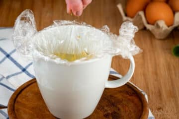 Spices and egg in mug.