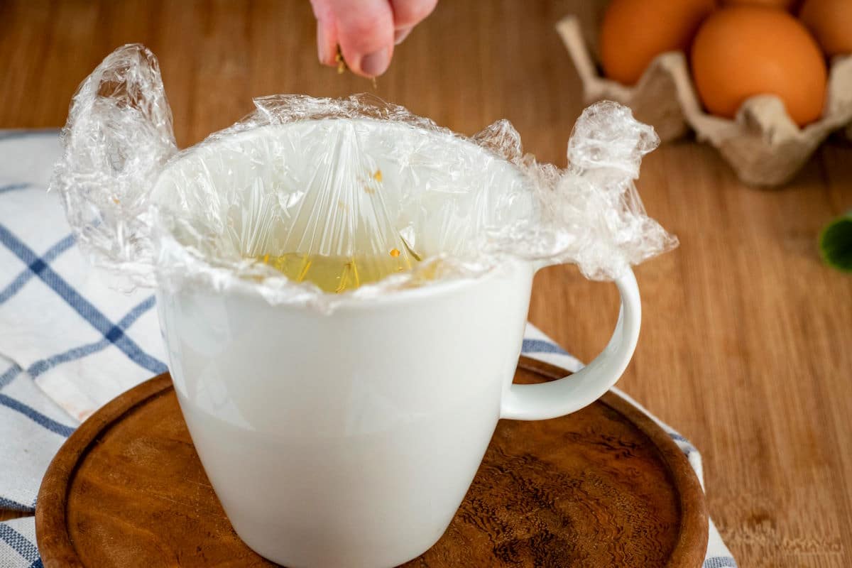 Spices and egg in mug.