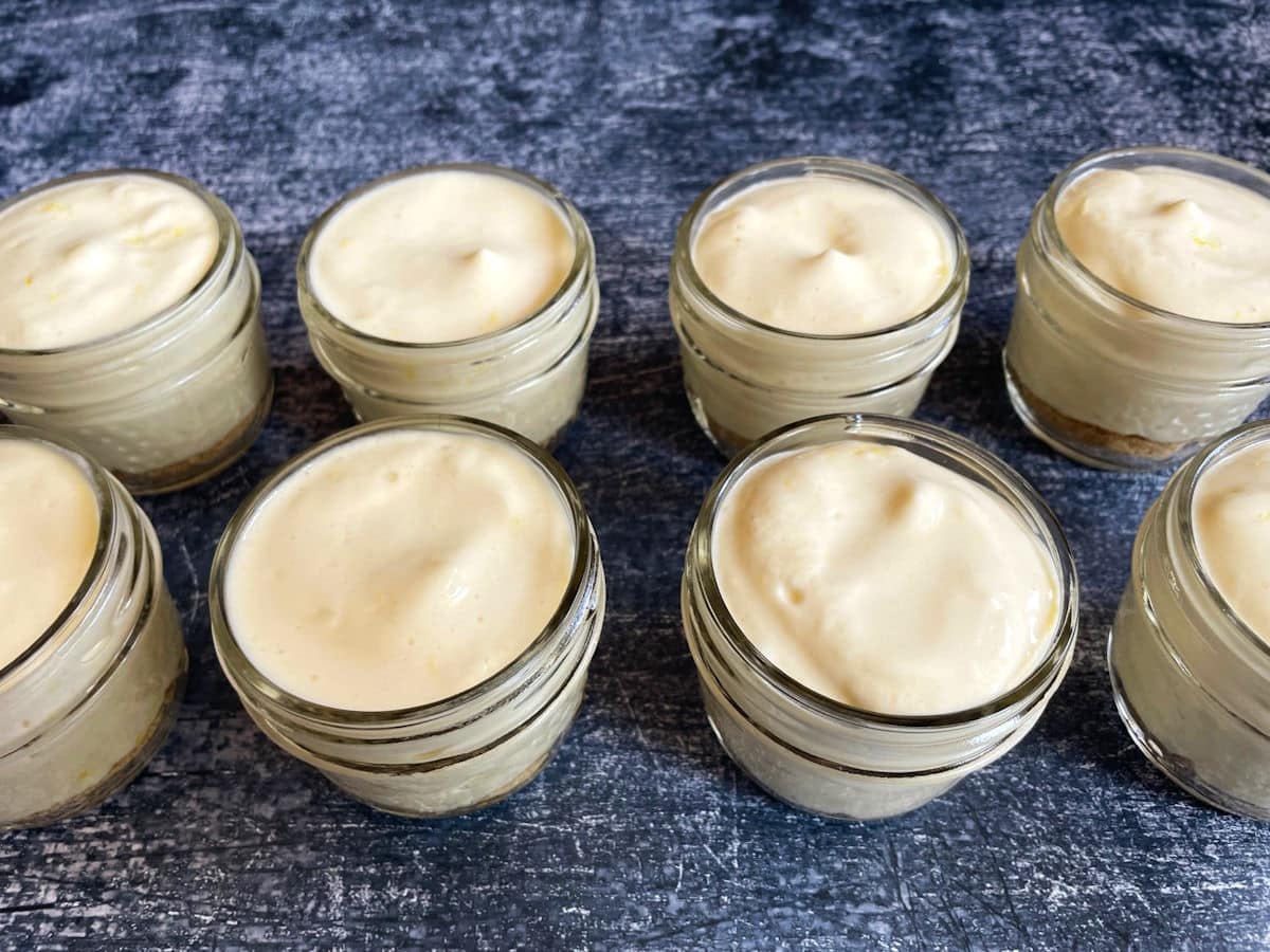 Iced lemon mousse and graham crumbs in jars.