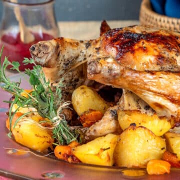 Roasted chicken with fresh herbs, vegetables and blackberry gravy.