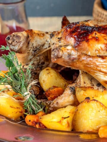Roasted chicken with fresh herbs, vegetables and blackberry gravy.