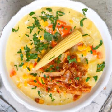 Kimchi chowder with corn in bowl.