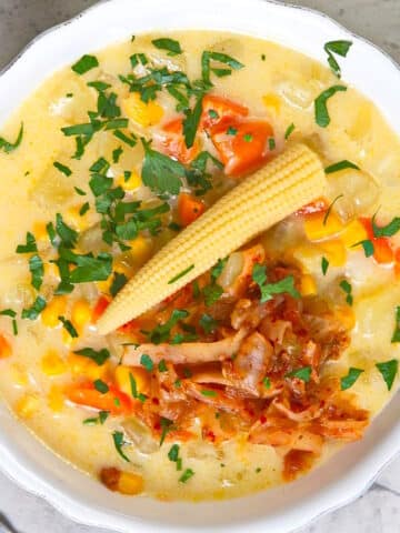 Kimchi chowder with corn in bowl.