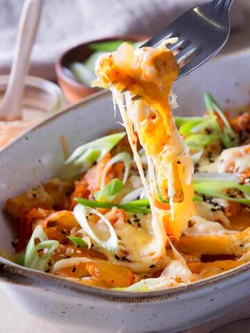 Kimchi fries with cheese in baking dish.