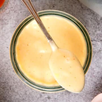 Kimchi mayo in jar and on spoon.