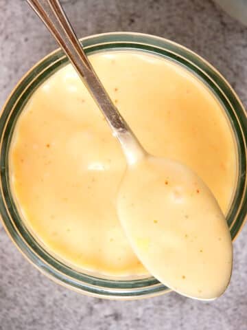 Kimchi mayo in jar and on spoon.