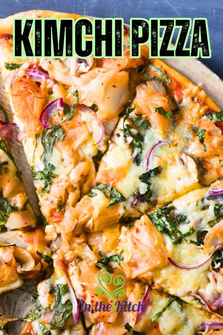Sliced kimchi pizza on serving board with text overlay that says 'kimchi pizza'.
