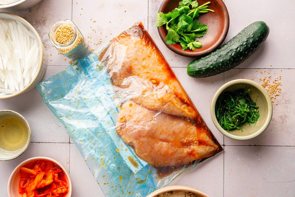 Chicken breasts marinating in ziptop bag.