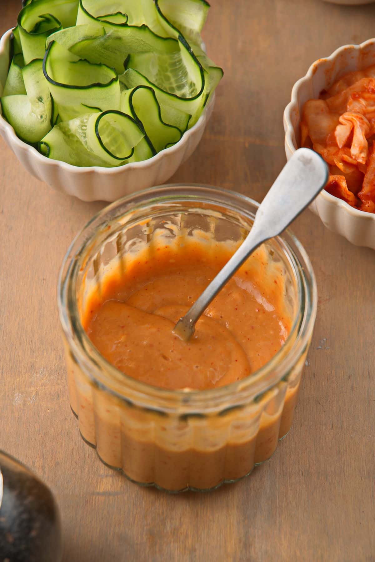 Kimchi salad dressing in small jar.