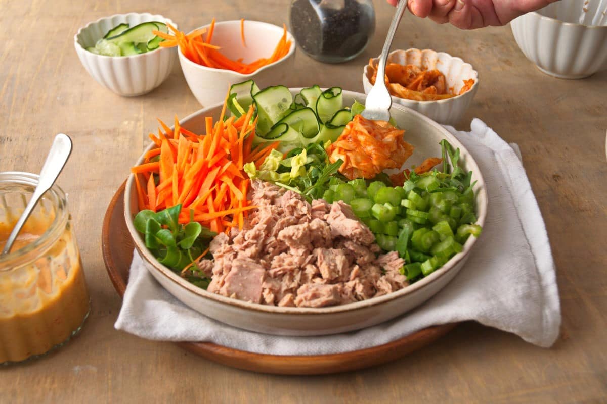 Kimchi salad on plate with fork.