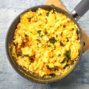 Korean kimchi scrambled eggs in pan.