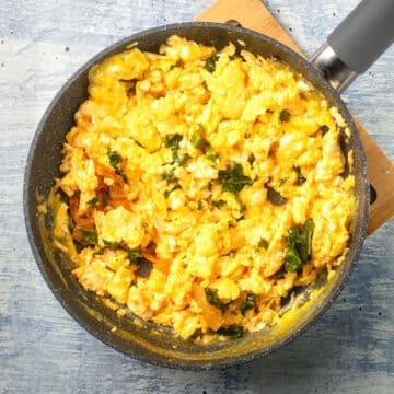 Korean kimchi scrambled eggs in pan.