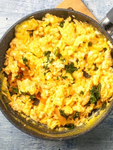 Korean kimchi scrambled eggs in pan.