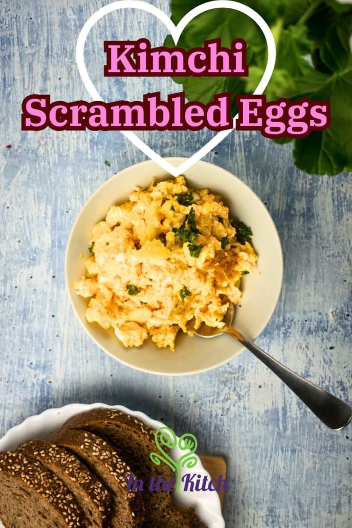 Kimchi scrambled eggs in bowl with text overlay that says 'kimchi scrambled eggs'.