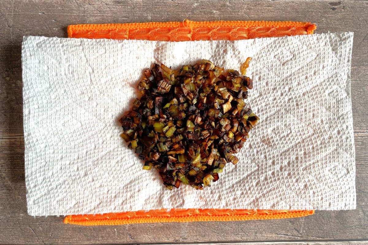 Frizzled leeks on paper towel.