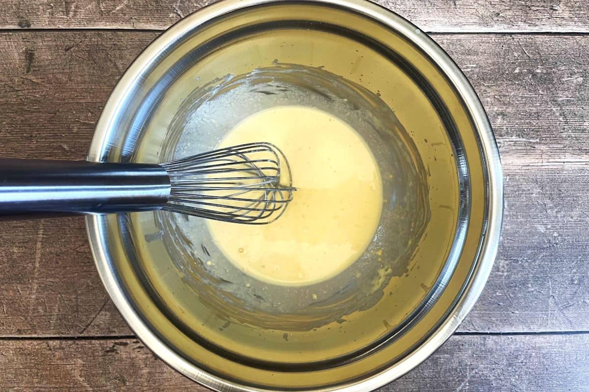 Chickpea flour and yogurt mixture in bowl.