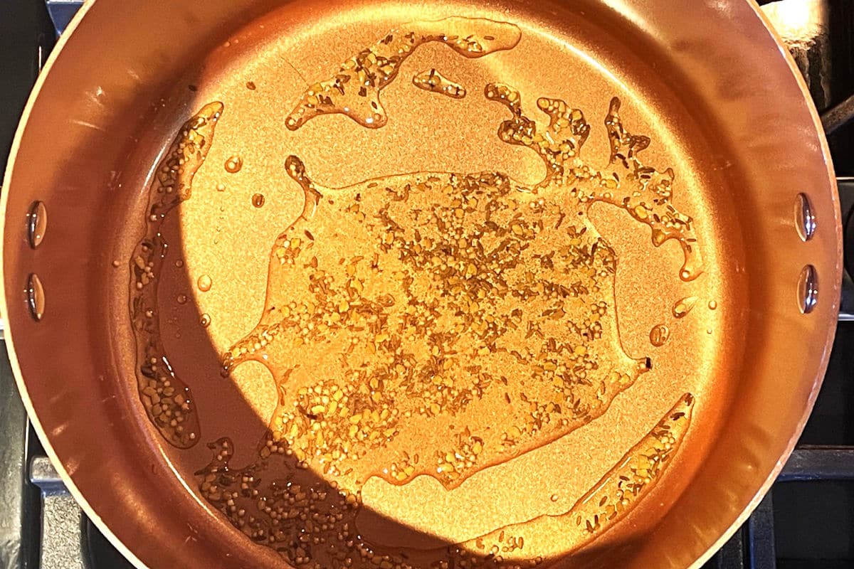 Seeds and oil in pot.