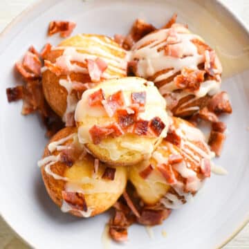 Maple bacon cake pops on plate.