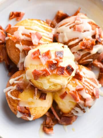 Maple bacon cake pops on plate.