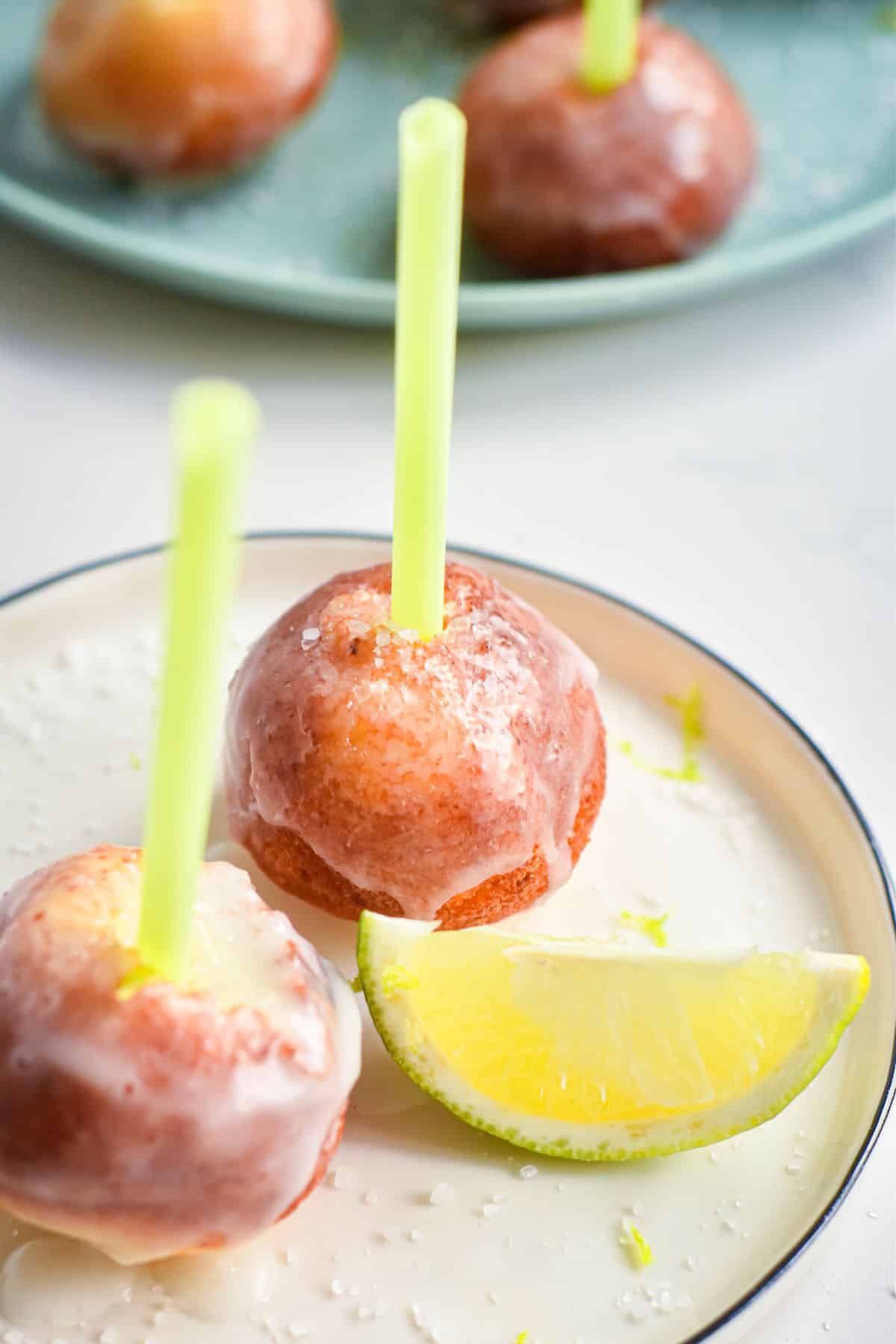 Margarita cake pops on small plate.