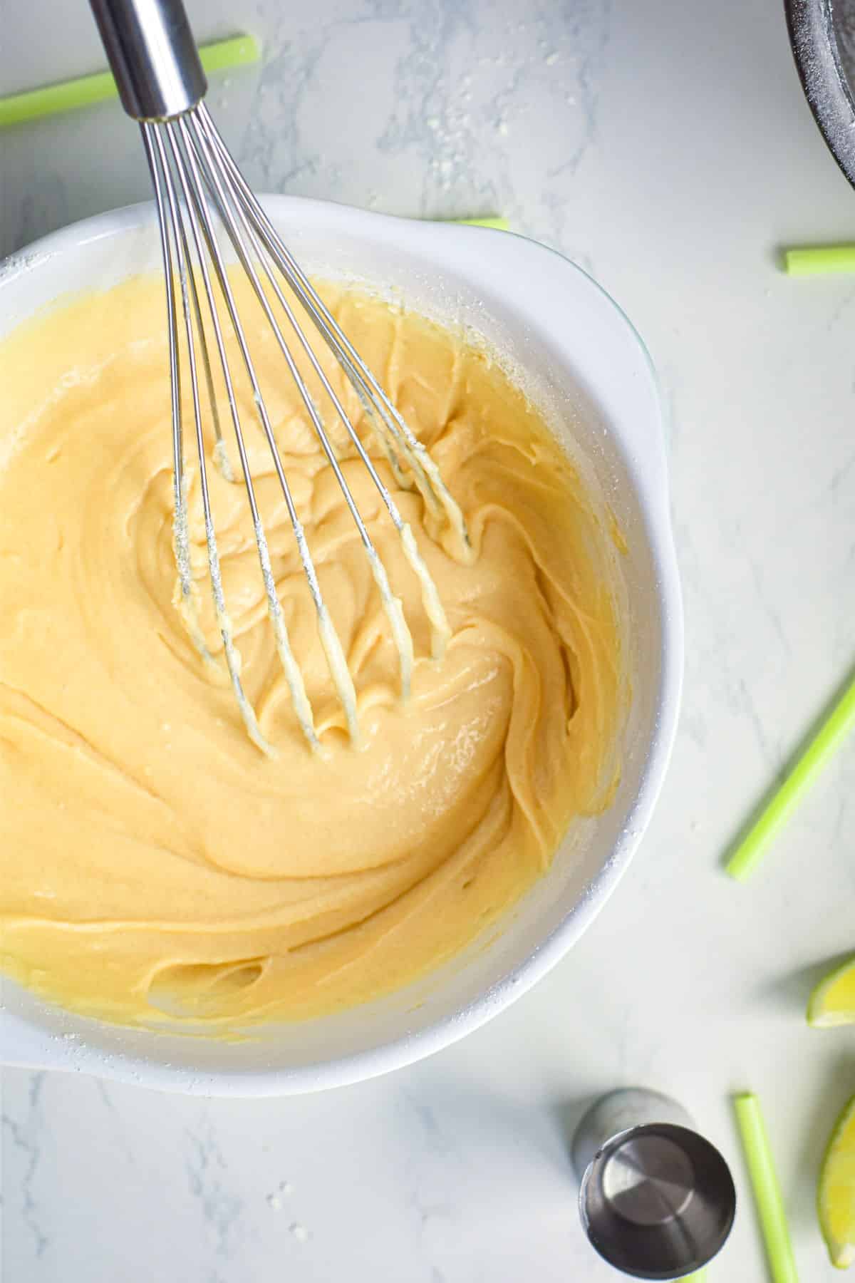 Margarita cake pop batter in bowl with whisk.