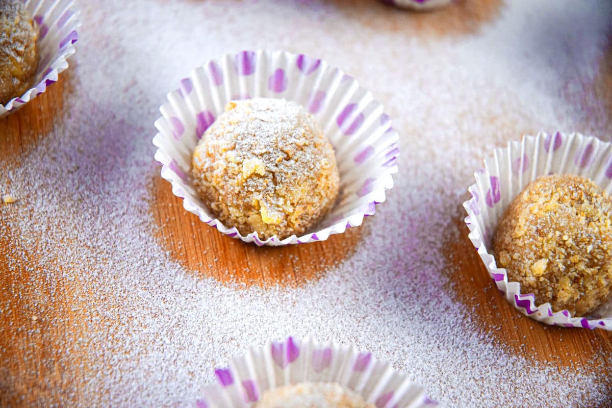 Marzipan balls dusted in icing sugar.
