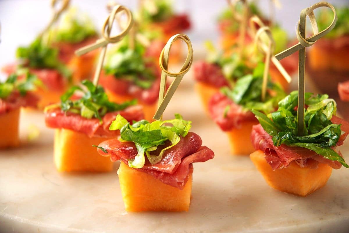 Skewered melon prosciutto appetizer.