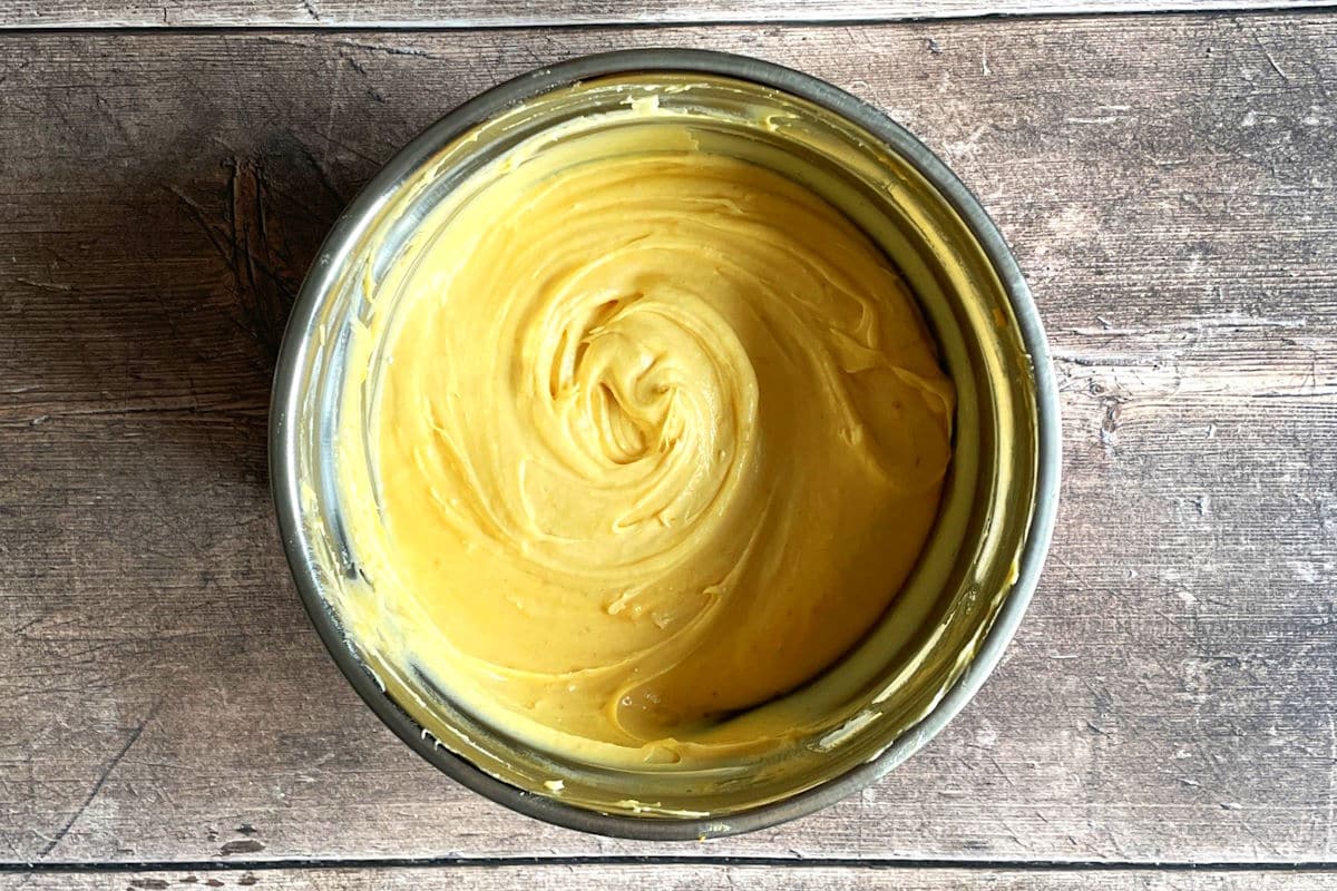 Pumpkin buttercream frosting in bowl.