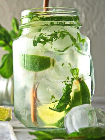 Mojito mocktail with mint and lime in glass.