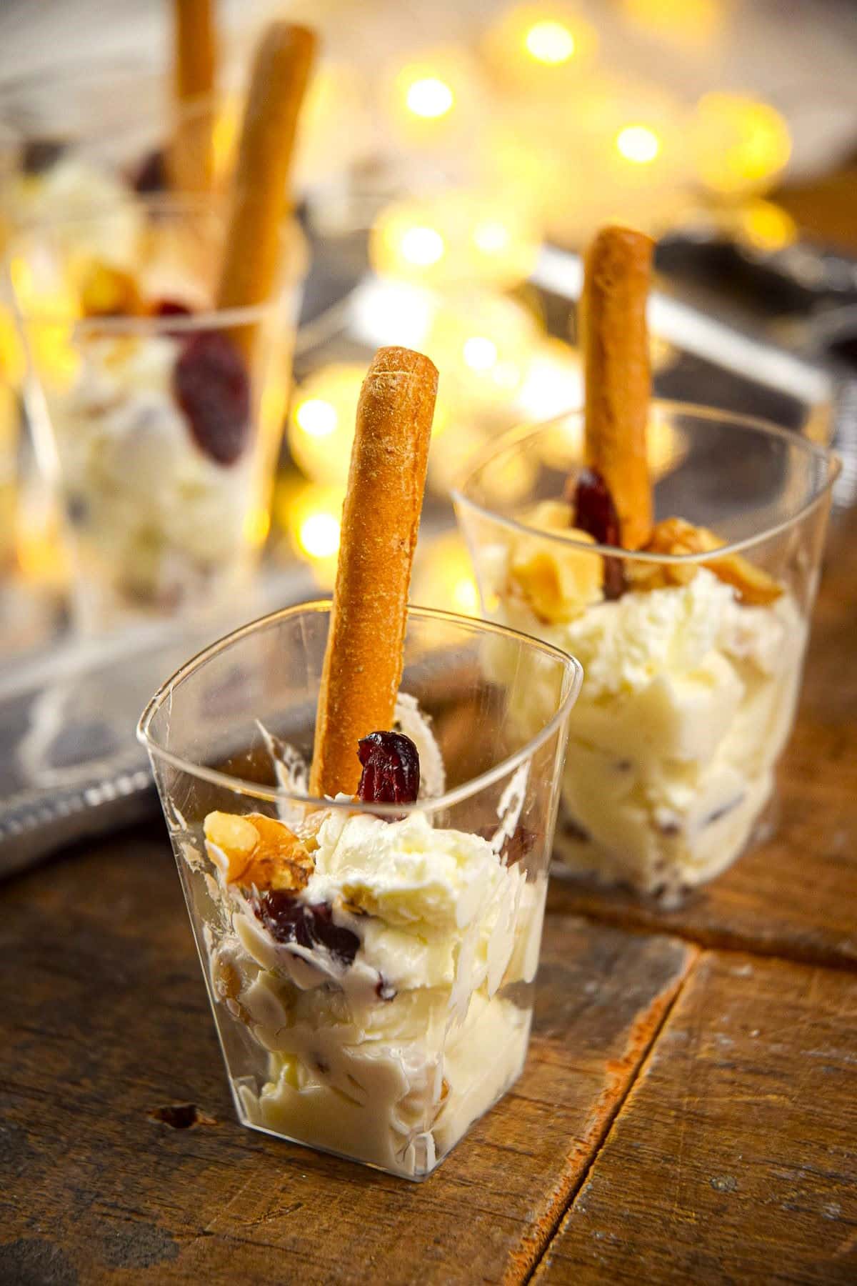 Goat cheese shots with mini breadsticks.