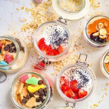 Oatmeal porridge with toppings in jars.