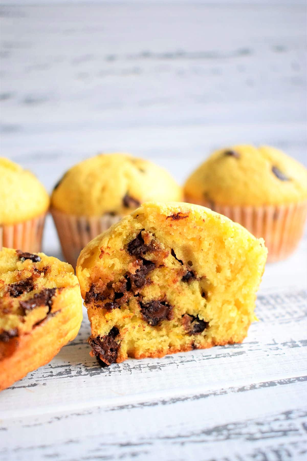 Orange chocolate chip muffin sliced in half.