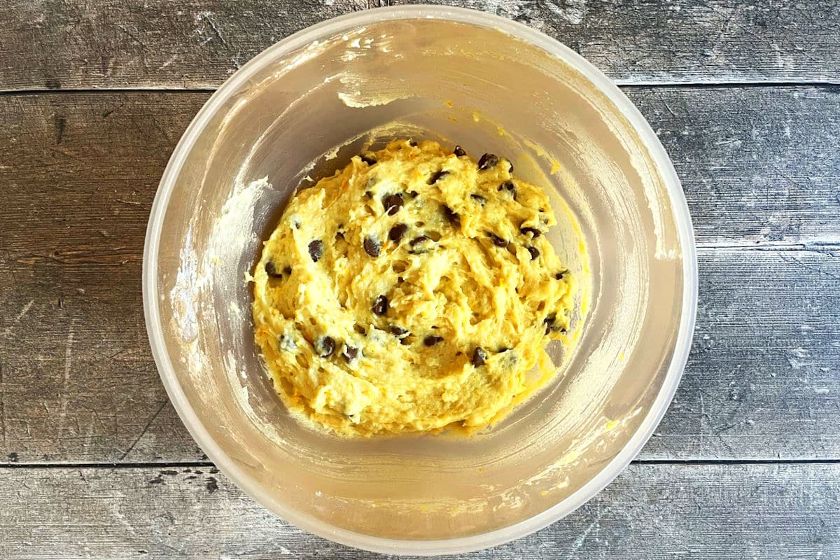 Orange chocolate chip muffin batter in bowl.