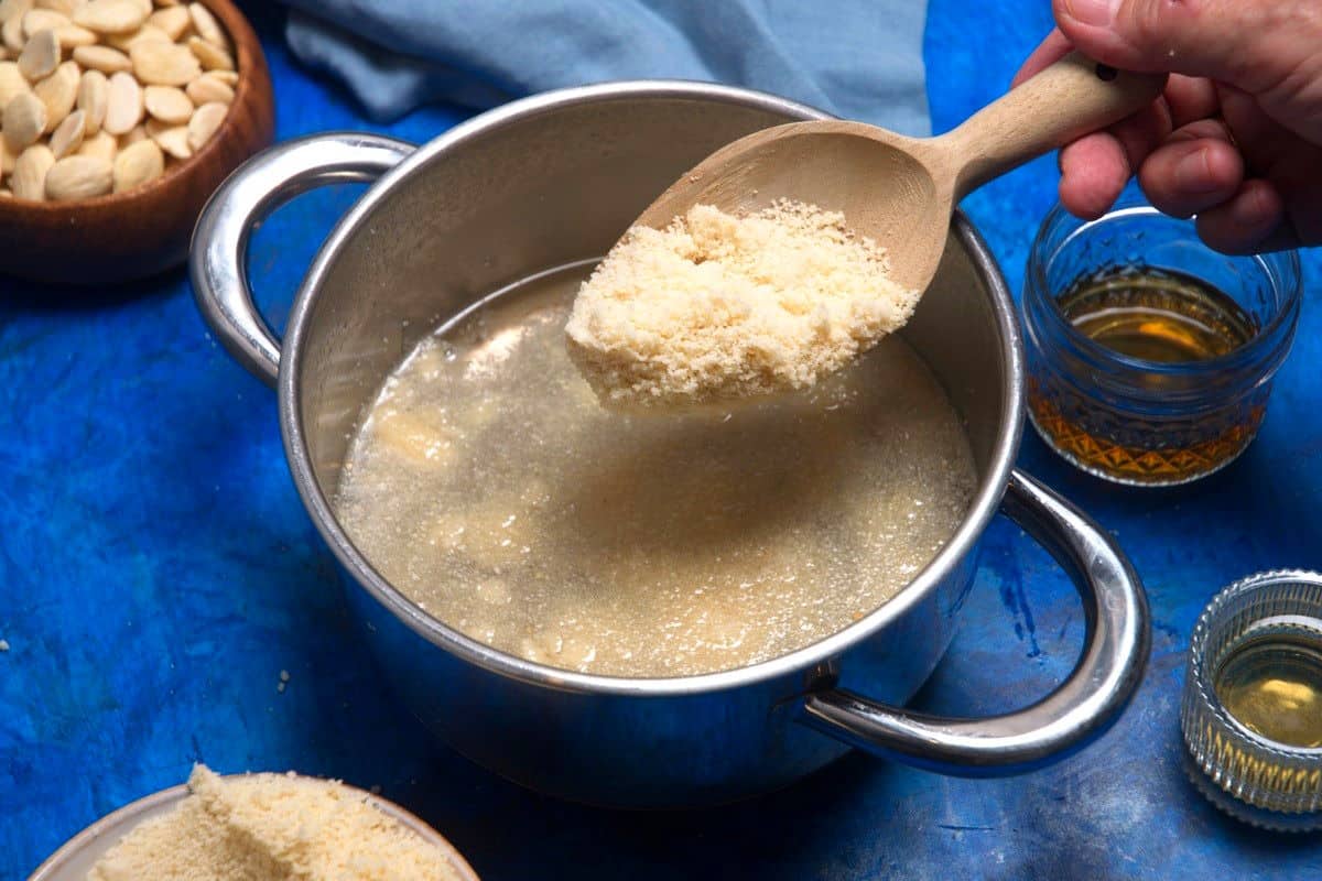 Ground almonds in pot with sugar water.